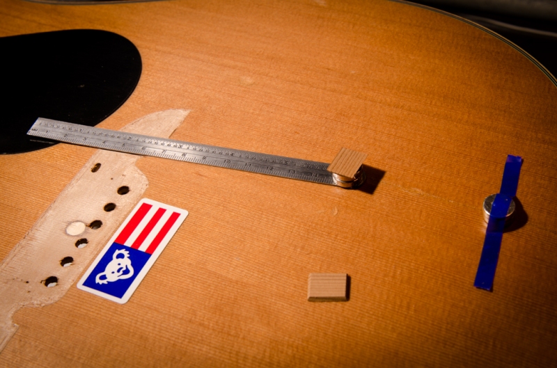 The cleat is double-stick taped to the magnet and a steel ruler is used to install the cleat through the soundhole.  Just make sure you get your magnet polarities correct.